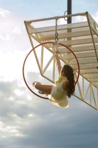 Cirque Bijou - Extraordinary Bodies - Circus artist Deb Roach performs on aerial hoop, she is missing her left arm