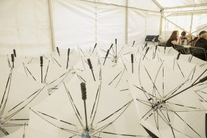 Umbrellas are stacked backstage ahead of the performance. Portolan, Sunderland Tall Ships, Cirque Bijou. Image Dan Prince.