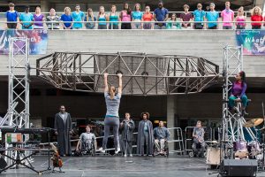 Extraordinary Bodies performer Aislinn Mulligan hangs from steal structure in What Am I Worth? National Theatre River Stage. Image Rob Harris.