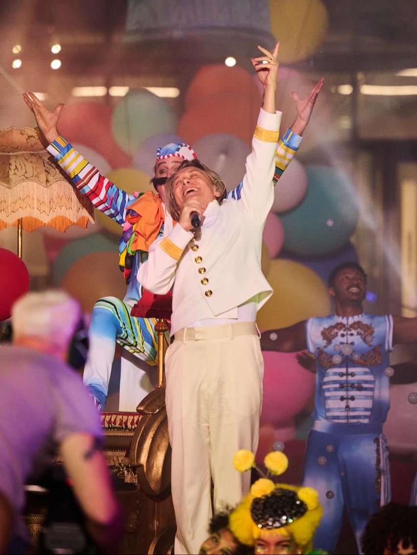 Take That performing surrounded by circus artists