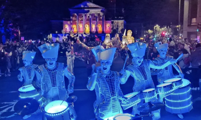 Ghostly space drummers with LED light up drums leading the parade