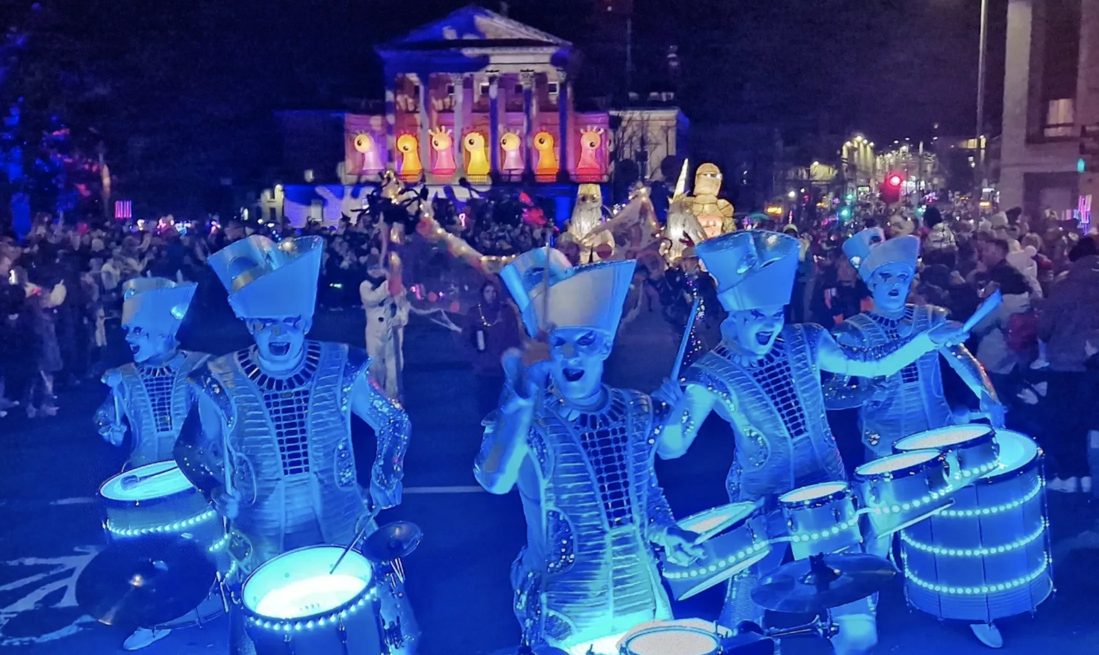 Ghostly space drummers with LED light up drums leading the parade