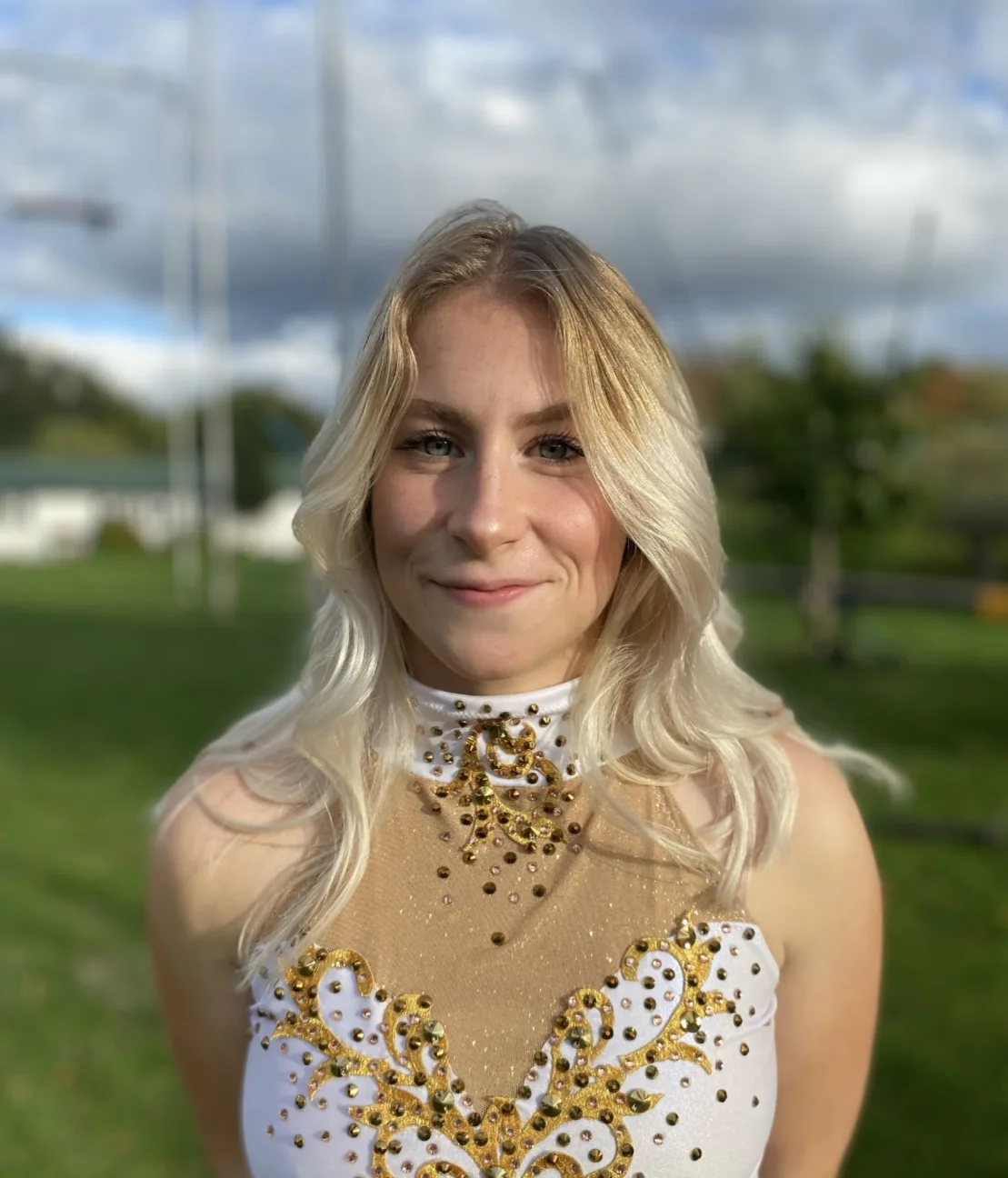 Headshot of Isadora Brag in her circus sparkly outfit