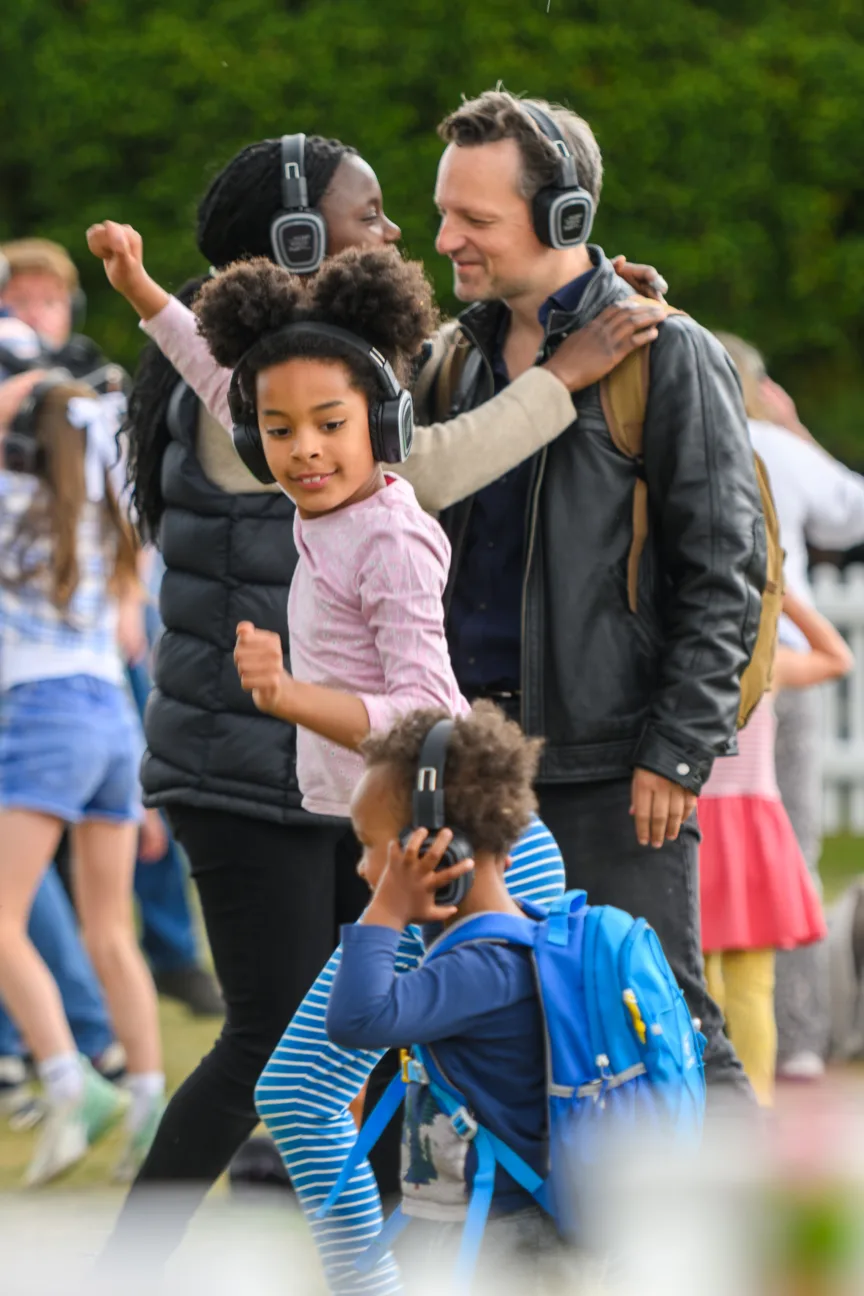 A family enjoying the silent disco.
